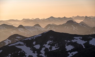 Mountain panorama, mountain peaks in soft light at sunset, view from the summit of Skala, Loen,