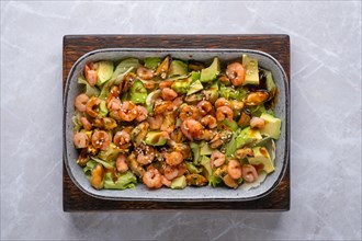 Top view of salad with shrimp, mussels and avocado