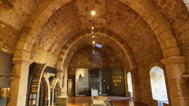 An exhibition room with vaulted ceiling in a historic stone construction, Museum, Chlemoutsi, High