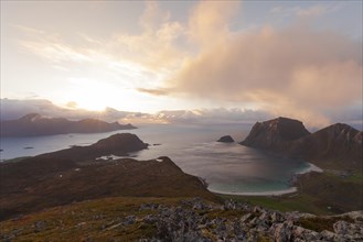 View of Haukland Beach from the summit of Holandsmelen, Lofoten. Dramatic sunset in autumn
