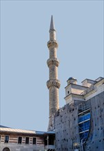 Minaret beside mosque in process of being renovated in Istanbul, Turkiye