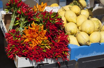 Chilli peppers and lemons on a market stall, Venice, Italy, Europe