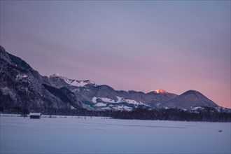 Snowy landscape at sunrise with mountain panorama, Nussdorf, Bavaria, Germany, Europe