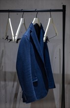 Suit Jacket Hanging in Office Cubby on a Clothes Hanger in Switzerland