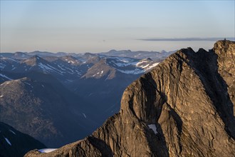Mountain peak in soft evening light, view from the summit of Skala at sunset, Loen, Norway, Europe