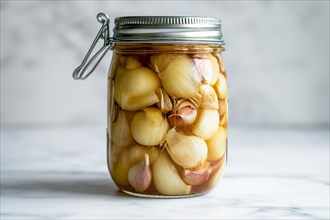 A closed preserving jar full of pickled garlic cloves and shallots on a marble surface, AI