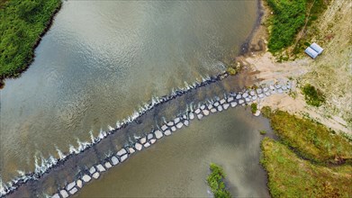 Aerial view of stone aeration footbridge across river in South Korea
