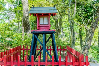Small wooden replica of Shinto shrine in Japanese garden park in Hiroshima, Japan, Asia