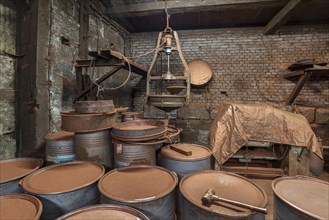 Bronze powder production room with filling bins in a metal powder mill, founded around 1900,