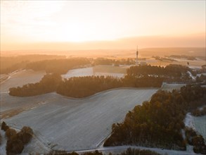 Winter agricultural landscape at sunrise with a wide view and soft light, Gechingen, Black Forest,