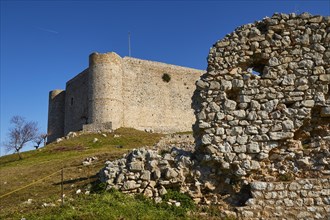 The ruins of an ancient castle, inner castle with a clear blue sky in the background, Chlemoutsi,