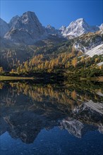 Mountains reflected in mountain lake, sun, autumn, Seebensee, Mieminger Kette, Tyrol, Austria,