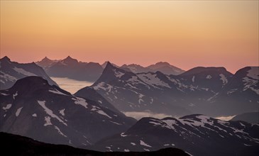 Mountain panorama, mountain peaks in soft light at sunset, view from the summit of Skala, Loen,