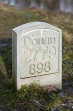 Marker stone at the confluence of the Breg and Brigach rivers to form the Danube, source of the