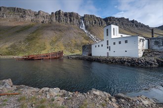 Baejararfoss waterfall, shipwreck, abandoned herring factory Djupavik, Reykjarfjoerour, Strandir,