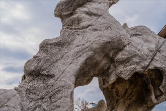 Closeup of large geological stone formation at public park on cloudy winter day in South Korea