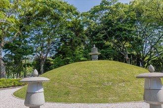 Round stone carved pagoda on hilltop in Hiroshima Peace Park in Hiroshima, Japan, Asia