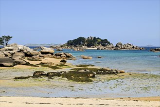 Bay of the pink granite coast with sandy beach and boulders, Tregastel, Cotes-d'Armor, Brittany,