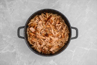 Top view of pulled pork in a large pan