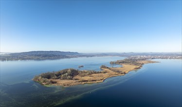 Aerial panorama of the Mettnau peninsula on a clear winter's day, with the town of Radolfzell on