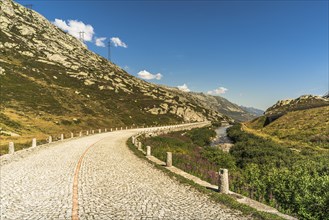 Gotthard Pass, mountain landscape and old pass road with cobblestones, Canton Ticino, Switzerland,