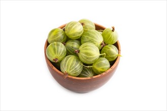 Fresh green gooseberry in clay bowl isolated on white background. side view, close up