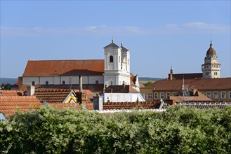 Town view with church and historical buildings under clear blue sky, view of Roman Catholic Church