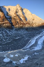 Glacier tongue and snow-covered mountain peak at sunrise, Grossglockner and Pasterze, autumn, Hohe