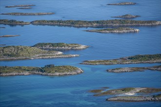 Rocky islands in the blue sea, Sea with archipelago islands, Vesteralen, Norway, Europe