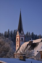 Church tower in the morning sun, winter, Niederndorf, Austria, Europe