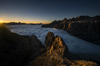 Sunrise over a sea of fog and Dolomite peaks in the background, Corvara, Dolomites, Italy, Europe