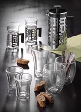 Various glasses, jug, table decoration