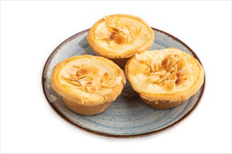 Traditional portuguese cakes pasteis de nata, custard small pies with almonds isolated on white