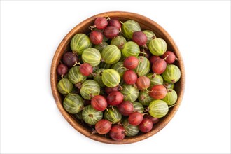 Fresh red and green gooseberry in wooden bowl isolated on white background. top view, flat lay,