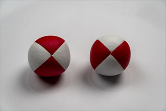 Two juggling balls in front of a white background, studio shot, Germany, Europe