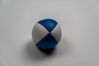 Juggling ball in front of a white background, studio shot, Germany, Europe