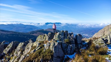 A man at the top of Mount Adarra, municipality of Urnieta in Gipuzkoa. Basque Country