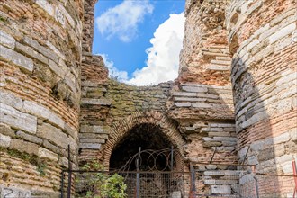 Entrance archway into ruins of ancient castle built between two towers in Istanbul, Tuerkiye