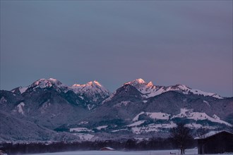 Snowy landscape at sunrise with mountain panorama, view of Wendelstein, Nussdorf, Bavaria, Germany,