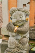 Balinese stone statue in Ubud, Bali, Indonesia. Travel, spirituality, religion