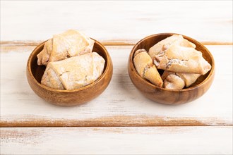 Homemade sweet cookie with apple jam on white wooden background. side view, close up