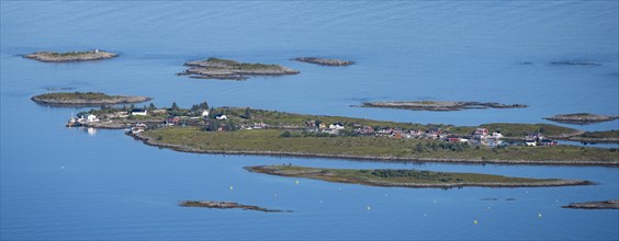 Rocky islands with colourful houses, sea with archipelago islands, Ulvagsundet, Vesteralen, Norway,