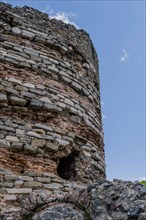 Closeup of hole in side of ancient castle tower ruins in Turkey