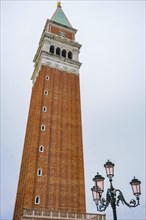 Bell Tower (Campanile di San Marco) in St. Mark Square, famous tourist attraction in Venice, Italy,