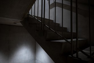 Modern Illuminated Concrete Staircase with Railing in Switzerland