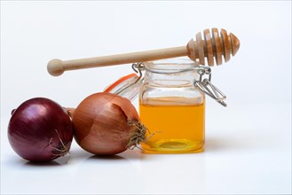 Honey in a jar and onions, ingredients for cough syrup