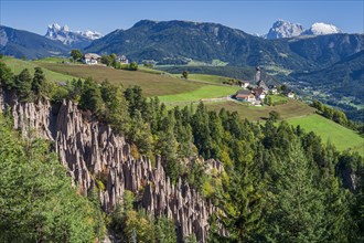 Earth pyramids on the Ritten at midday, Geislerspitzen and Schlern in the background, South Tyrol,