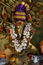 Hindu elephant god Ganesha adorned with a jasmine necklace, India, Asia