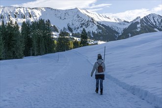 Hiker in the snow, snow hiking, near Riezlern, behind Fellhorn, Kleinwalsertal, Vorarlberg,