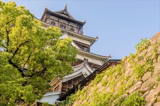 Exterior of Hiroshima Castle on hilltop in Japan